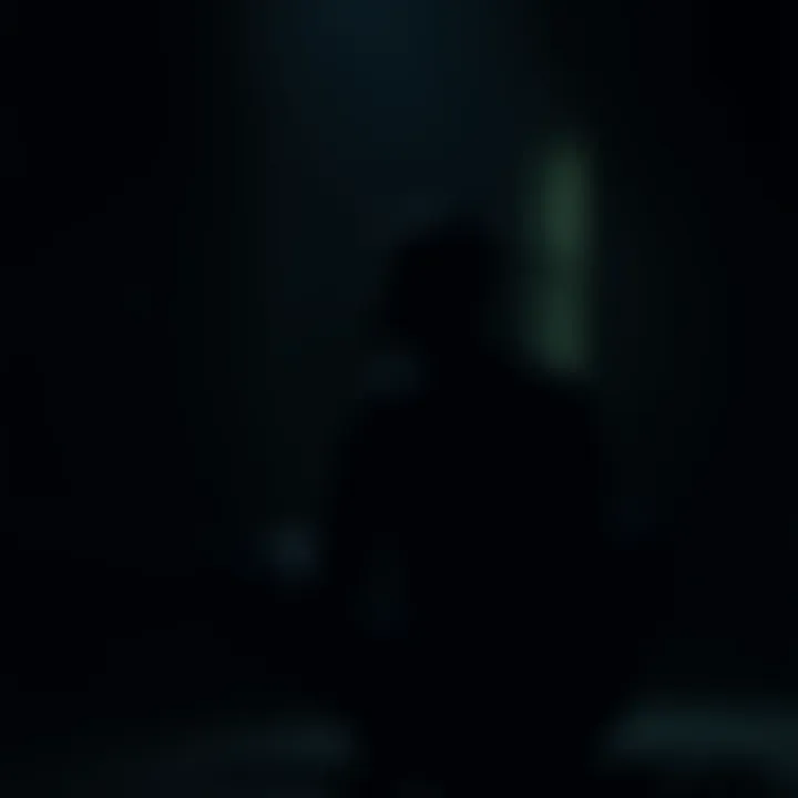 A man sitting alone in a dark room, looking troubled, reflecting on his beliefs about life and death.