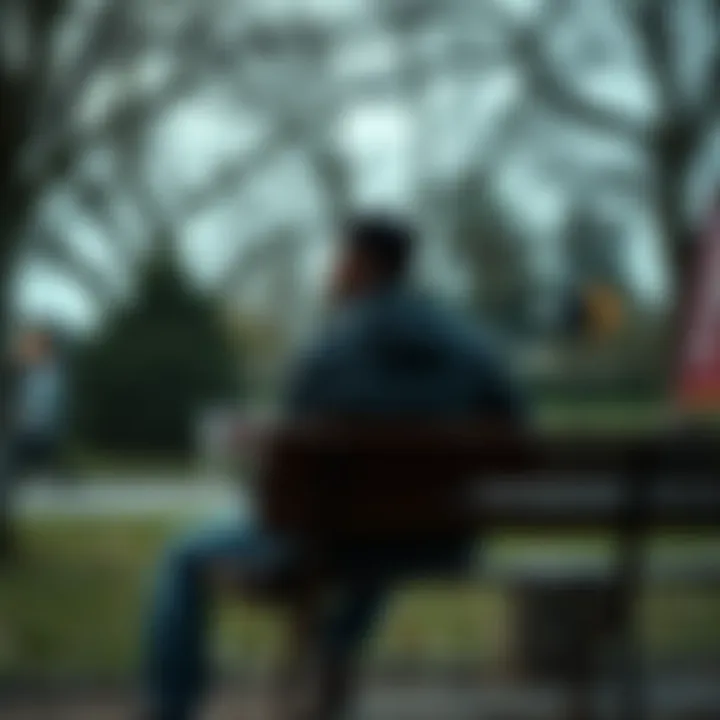 A young man sitting on a park bench, looking thoughtfully into the distance, symbolizing his journey to change his reputation and self-image.