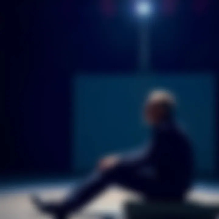 A man sitting alone, looking thoughtful as he considers steps for improving himself and building confidence.
