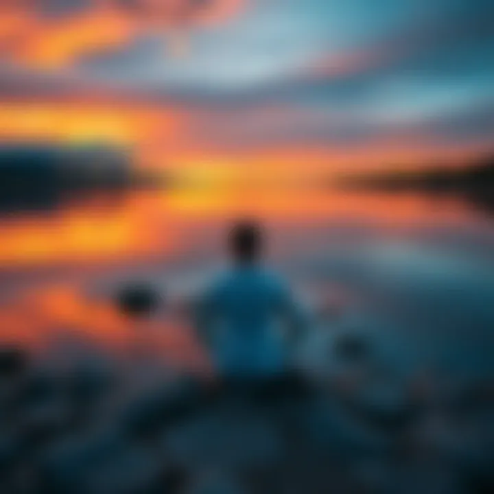 Individual seated in meditation pose by a calm lake, reflecting on their spiritual journey