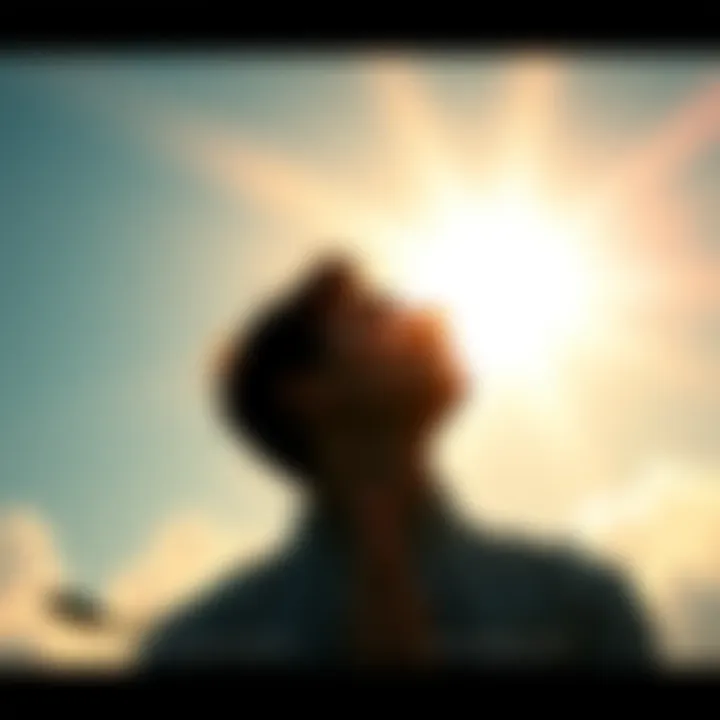 A person looking up at the sky with hands raised in prayer, surrounded by warm light.