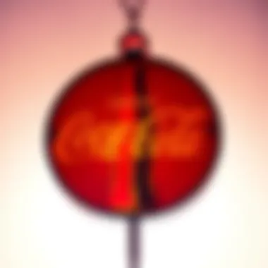 A vintage Coca Cola logo with a hífen included in the design, set against a bright background.