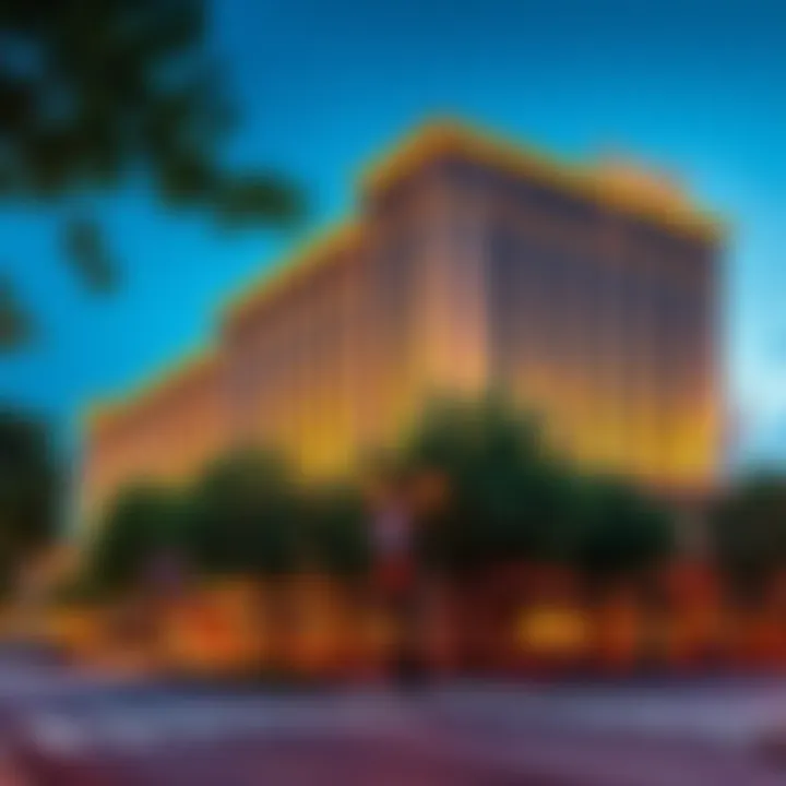 Exterior view of the Omni Hotel in Charlottesville, VA with trees and street in front