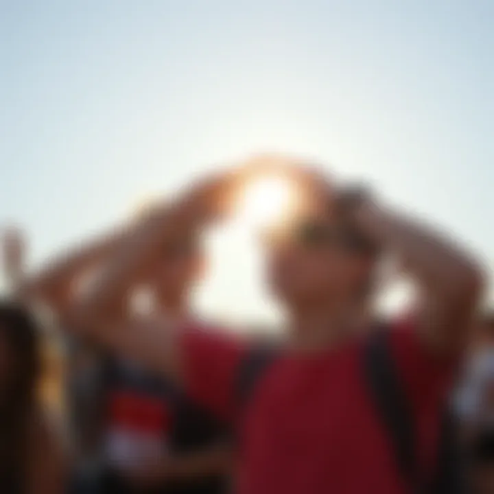 A group of people in the UK shielding themselves from the bright sun while outdoors, highlighting the increased intensity of sunlight.