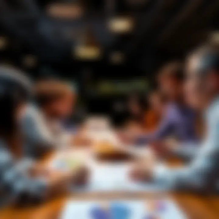 A group of people sharing and discussing colorful charts at a table