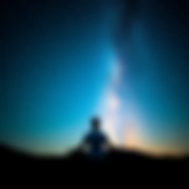 A person sits cross-legged on the ground, meditating under a clear, starry night sky, connecting with the universe.