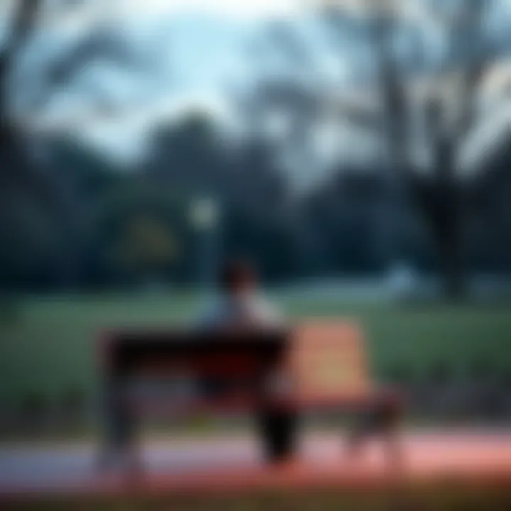 A person sitting alone on a park bench looking contemplative after a breakup, with trees in the background.
