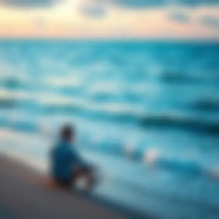Individual sitting alone on the beach, gazing at the ocean, contemplating life after a breakup