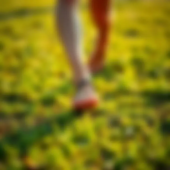 A person practicing zen walking on green grass, connecting with nature while enjoying the sun.