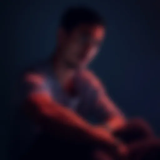 A person sitting with a worried expression, looking down as they ponder decisions, surrounded by dim light to symbolize self-doubt.