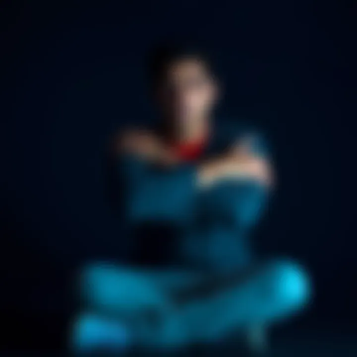 Person in deep thought Individual sitting alone, contemplating their feelings about a relationship with crossed arms, symbolizing emotional stubbornness and neglect.
