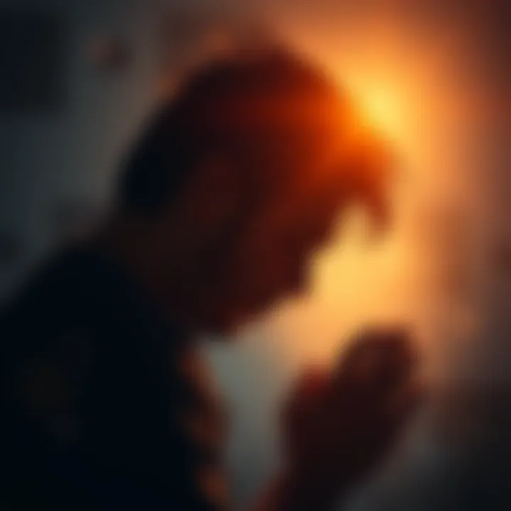 Individual with head down in a moment of prayer, surrounded by soft light symbolizing hope and connection