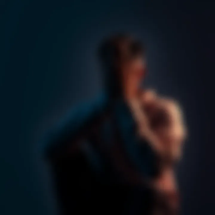 A person sitting alone, looking thoughtful with their hands on their face, symbolizing the struggle of shadow work