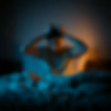 Person Struggling to Sleep Individual sitting on a bed with hands on their head, looking stressed and tired, surrounded by a dark bedroom.