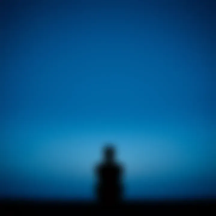 Person looking thoughtful A person sitting alone, looking contemplative with a distant expression, symbolizing feelings of emptiness and searching for meaning.