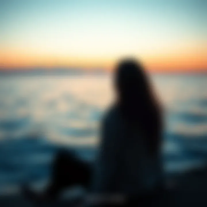 A person sitting near a calm ocean, looking contemplative and emotional, reflecting the deep feelings of a Pisces.