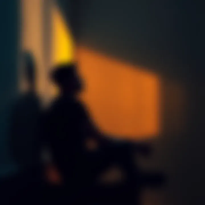 A person sitting in a dimly lit room, looking contemplative with shadows on the wall, representing uncertainty and introspection.