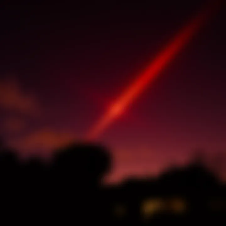 A bright red light glowing in the night sky above a silhouette of trees and buildings, with residents looking up in curiosity.