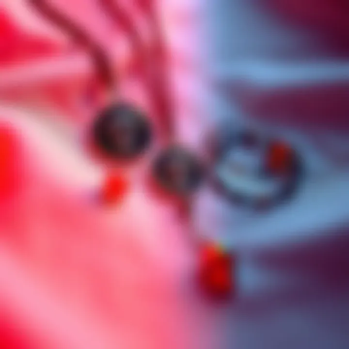 A necklace and bracelet with Santa Muerte symbols displayed on a soft fabric background