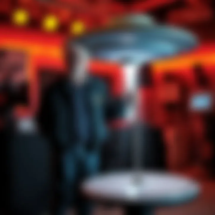 Steven Spielberg stands next to a model of a UFO, surrounded by film equipment, hinting at his new movie's theme.