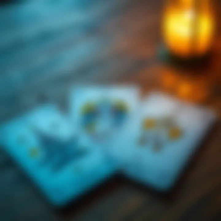 A close-up of tarot cards, including The Tower, Two of Wands, and Two of Cups, laid out on a wooden table with a soft light illuminating them.
