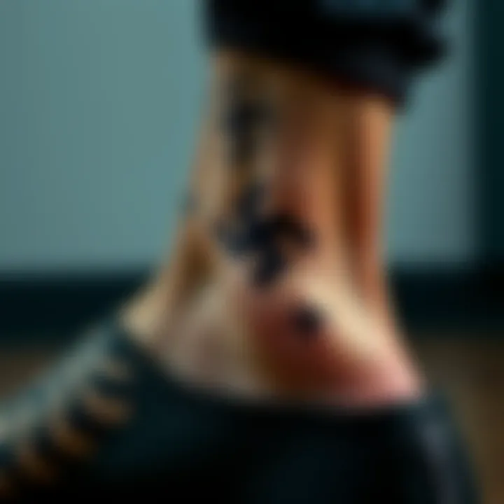 Close-up of a man's ankle showing a tattoo that some believe resembles a swastika with other nearby tattoos for context
