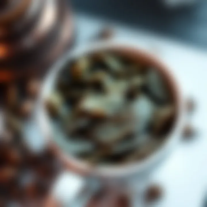 A close-up of tea leaves in a white cup showing distinct shapes for tea leaf reading