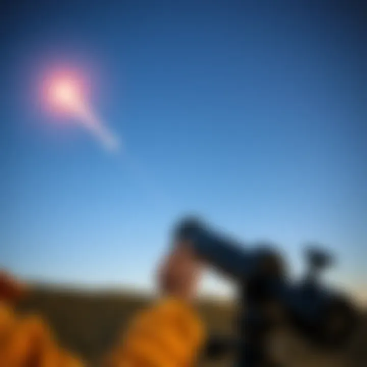 Person using a telescope to film a silver object moving quickly through a clear sky at night