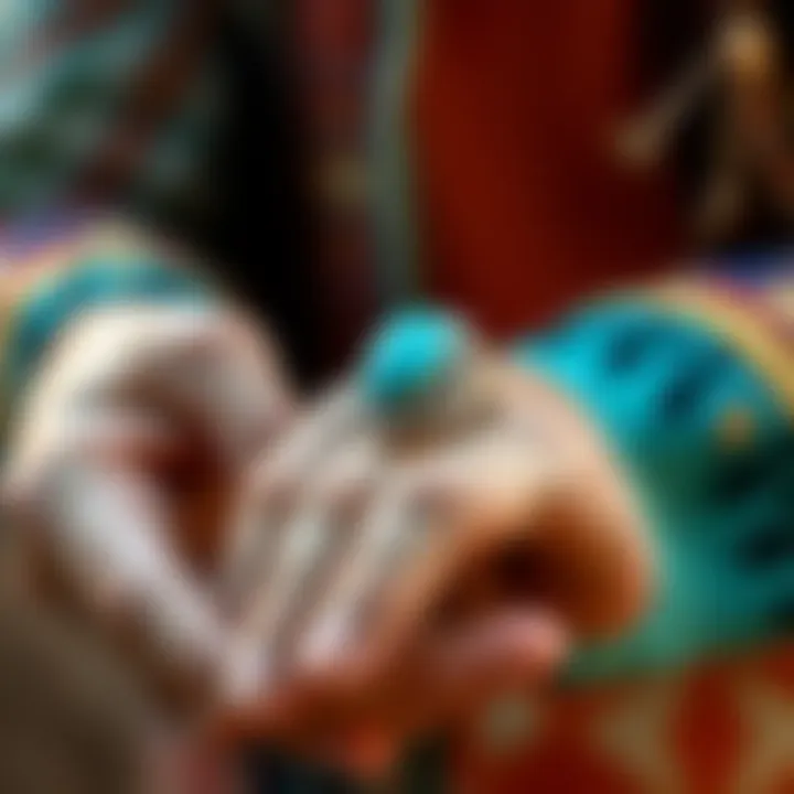A close-up of a person's hands holding a beautiful turquoise ring, showcasing its vibrant blue color and intricate silver setting, symbolizing Native American craftsmanship.
