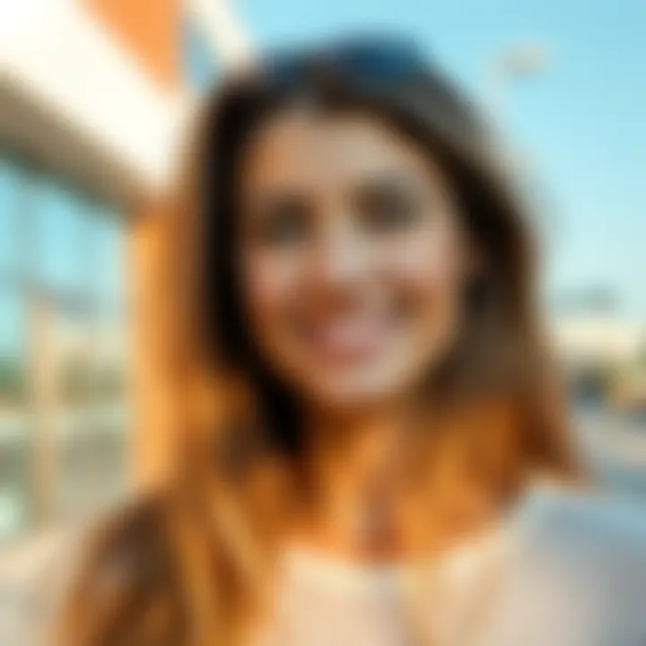 A young woman smiling, showcasing her hollow cheeks and a slim face. She has long hair and is in a bright outdoor setting, looking confident and healthy.