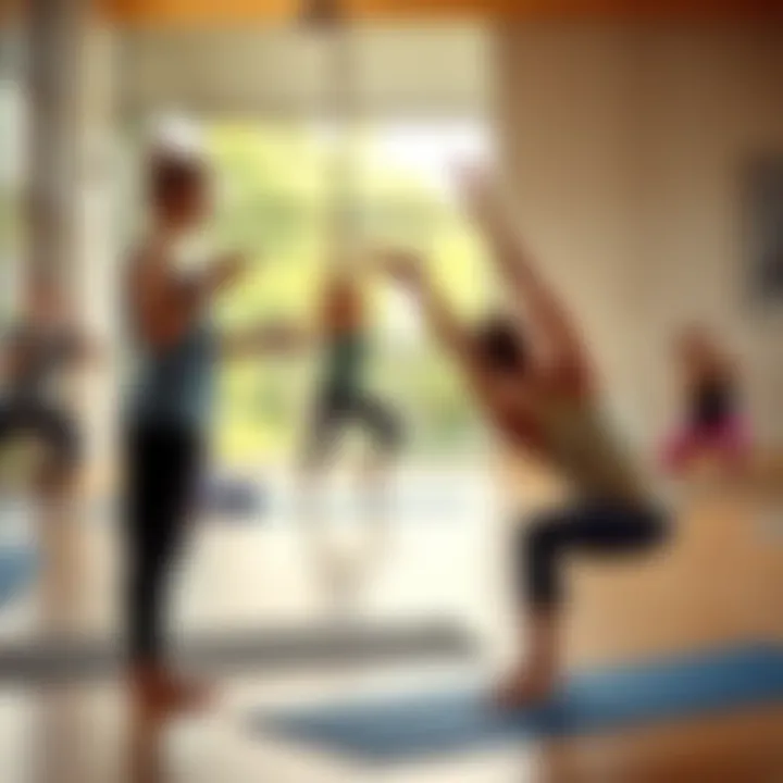 A yoga teacher guiding a class while an asana instructor demonstrates a pose.